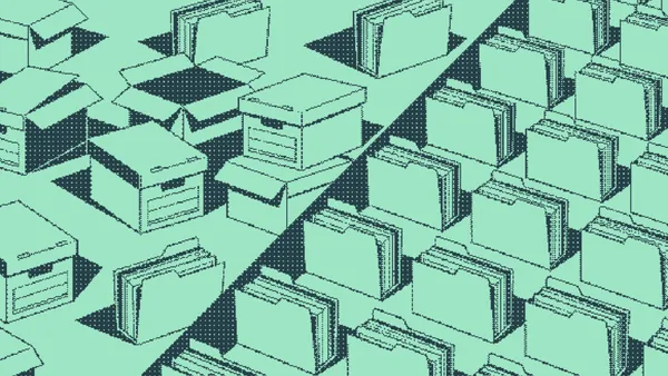 Open boxes spilling papers beside identical filing folders in neat rows
