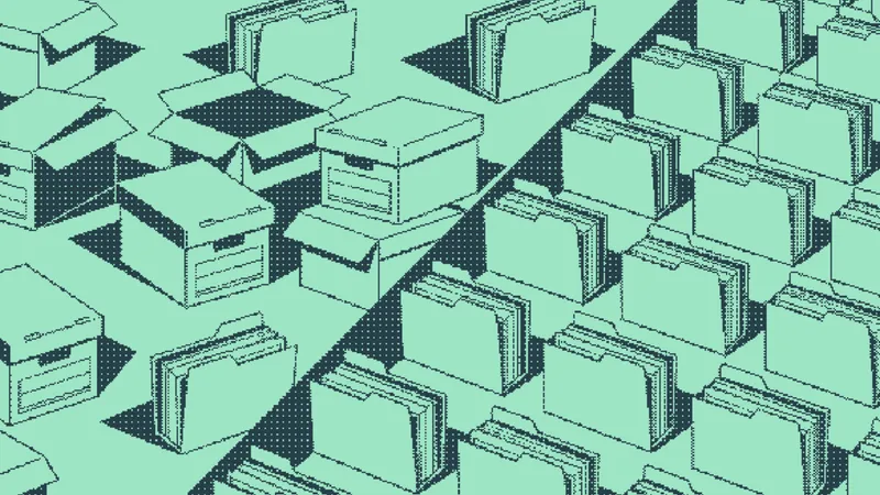 Open boxes spilling papers beside identical filing folders in neat rows