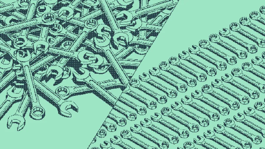 Wrenches tangled in a heap beside wrenches lined up in neat rows